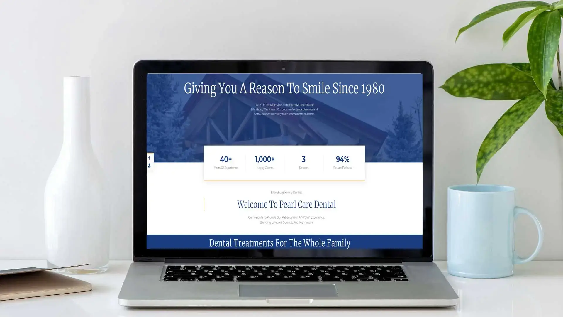 About The Website Designer other projects computers showing a dentist website on a white computer desk