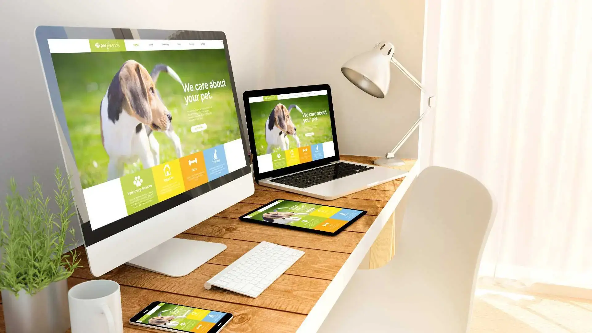 About The Website Designer other projects computers showing a veterinarian website on a wood computer desk