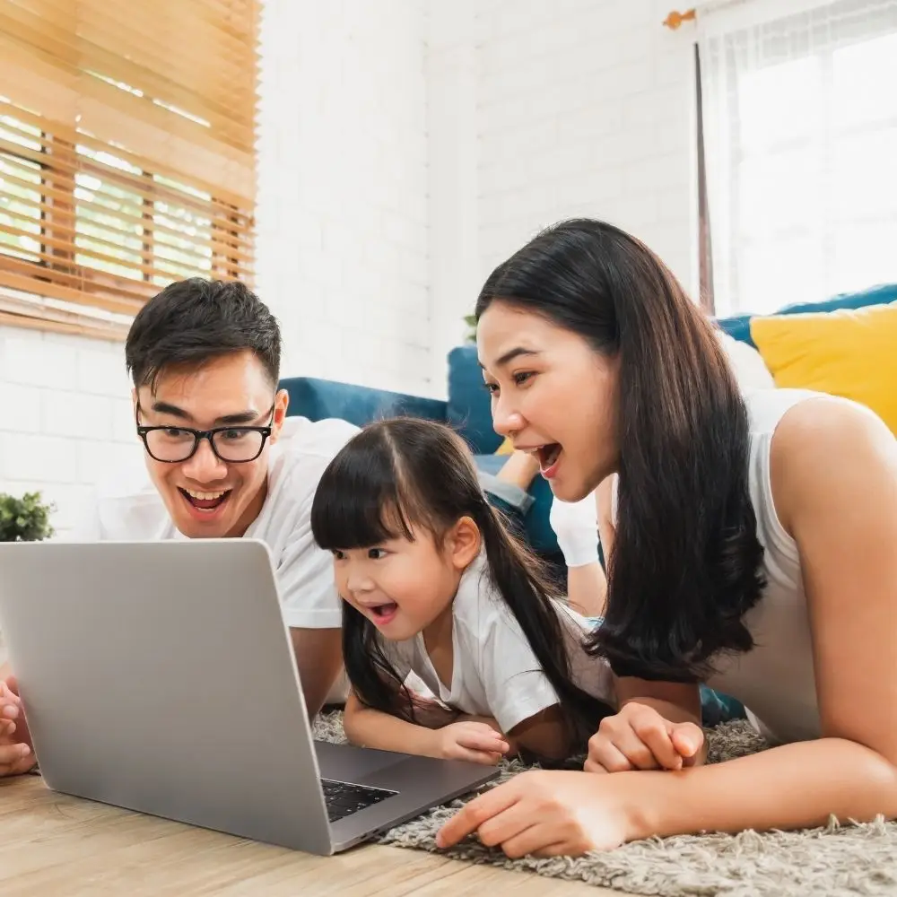 A Family of Three on laptop to Contact CyberGuard Familes